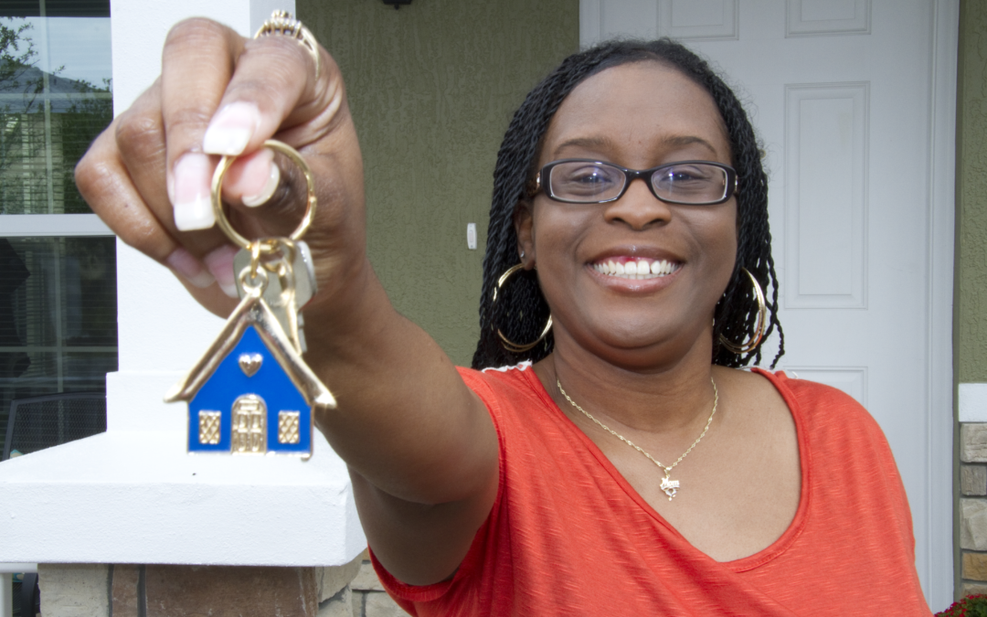 A Habitat homeowner with a key