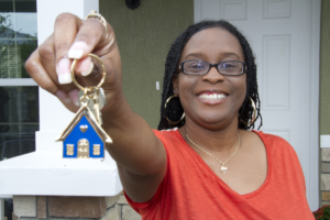 A Habitat homeowner with a key
