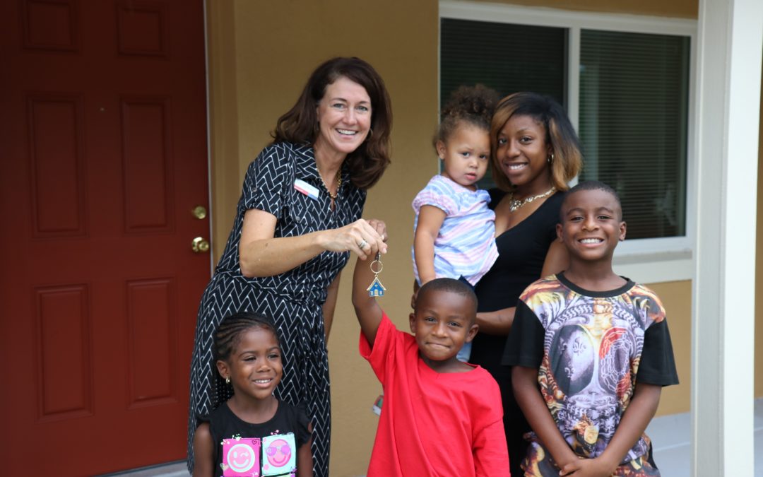 Marcella and her family pictured with Jodi Hardman, SVP, Market Manager, Bank of America