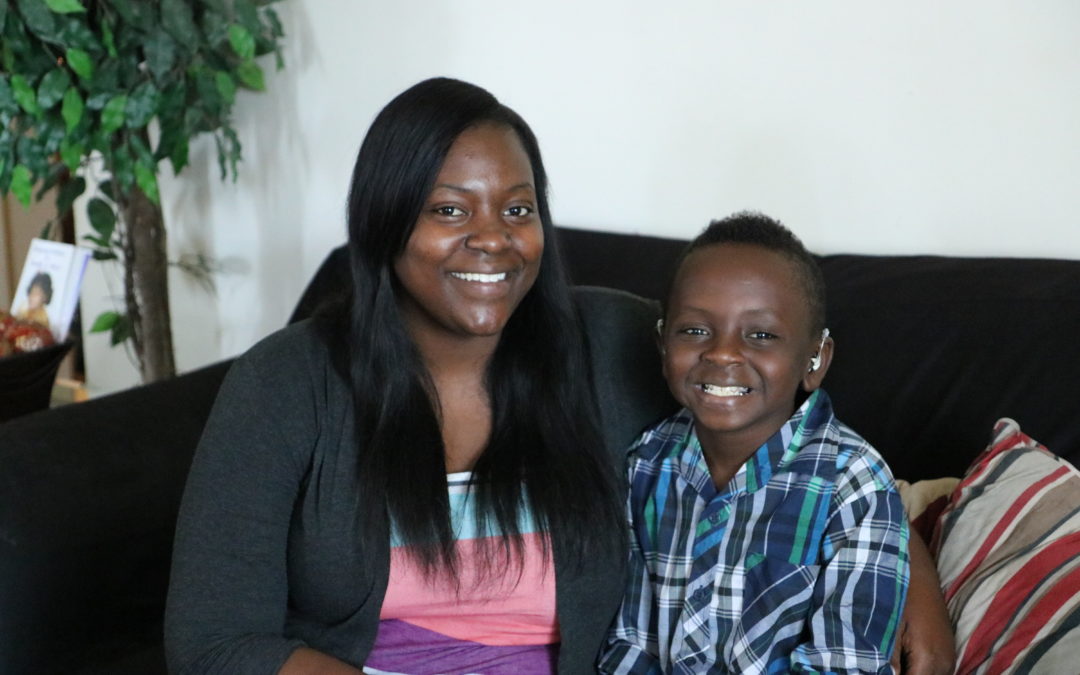 Habitat homeowner Princess poses with her son, Javarius