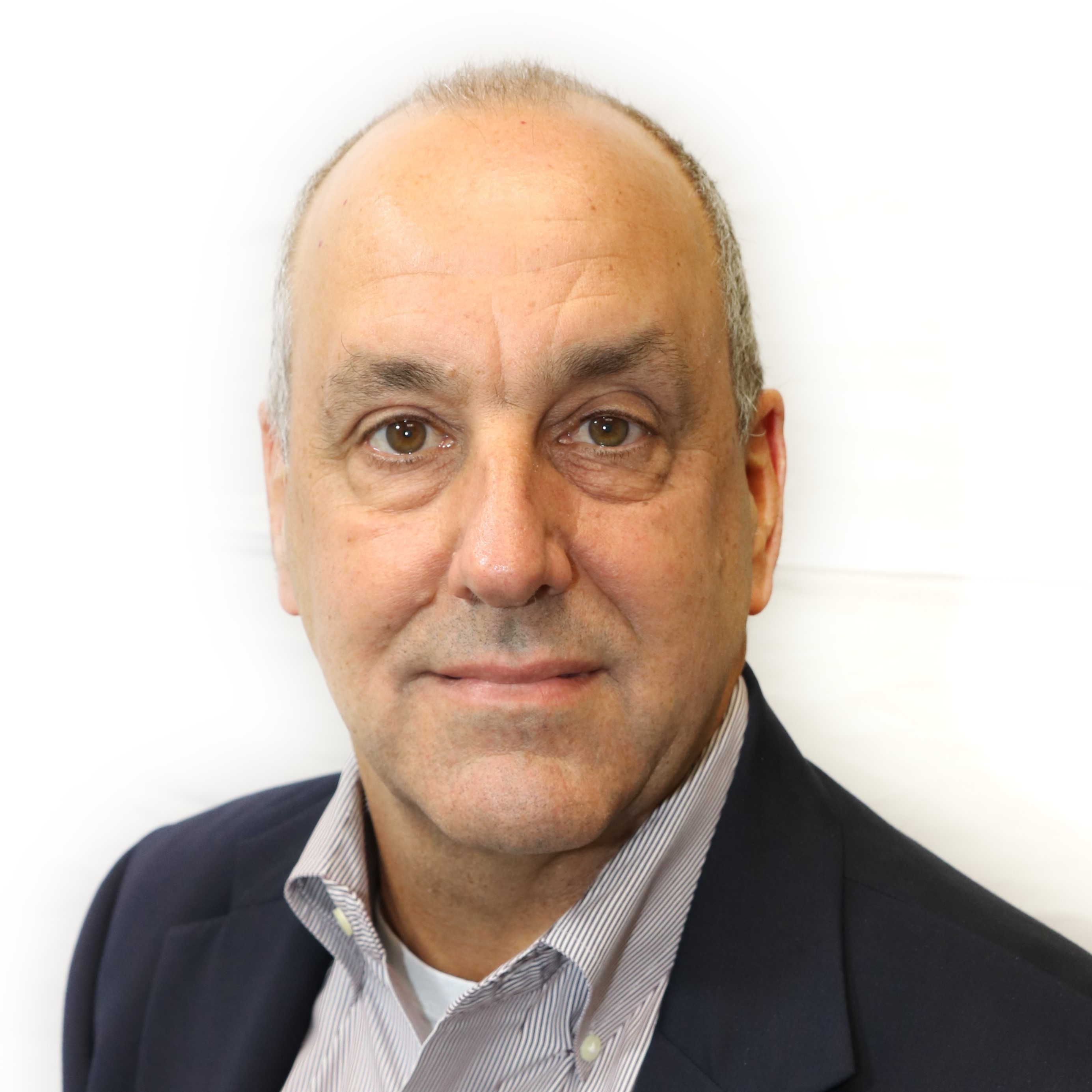 Business man smiling at camera in front of white background