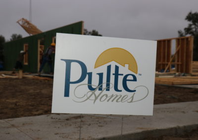 Pulte Homes sign in front of walls being raised