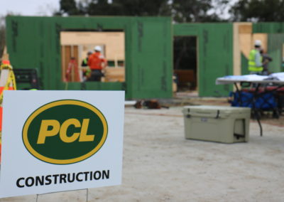 PCL Construction sign in front of in-progress house