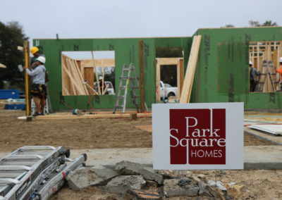 Park Square Homes sign in front of in-progress house