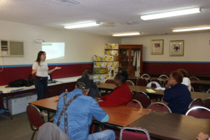 A Fleet Farming representative speaks to Greater Malibu Groves residents at a local church. 