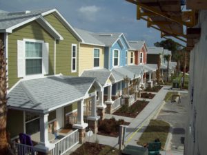 High shot of row of town houses in green, blue, yellow and red