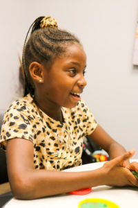 Juliet's daughter playing with Play-Doh at headquarters