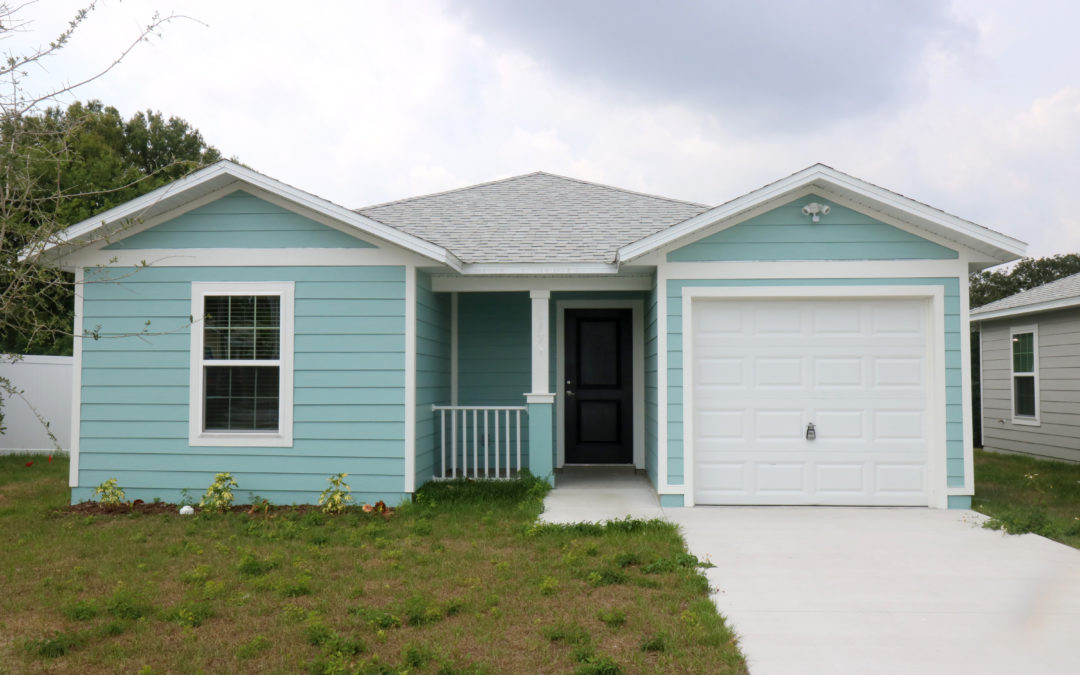 A blue house with white trim.