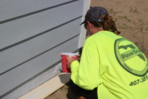 A PaverScape volunteer works at a Habitat Orlando & Osceola build site.