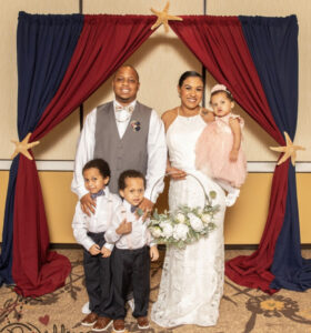 A family of five poses for a photo. They are now future homeowners.