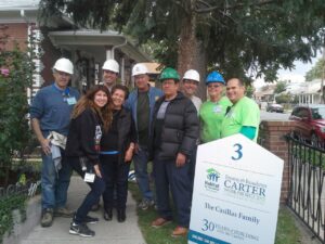 Volunteer coordinator David Bunzel poses with other Habitat volunteers.