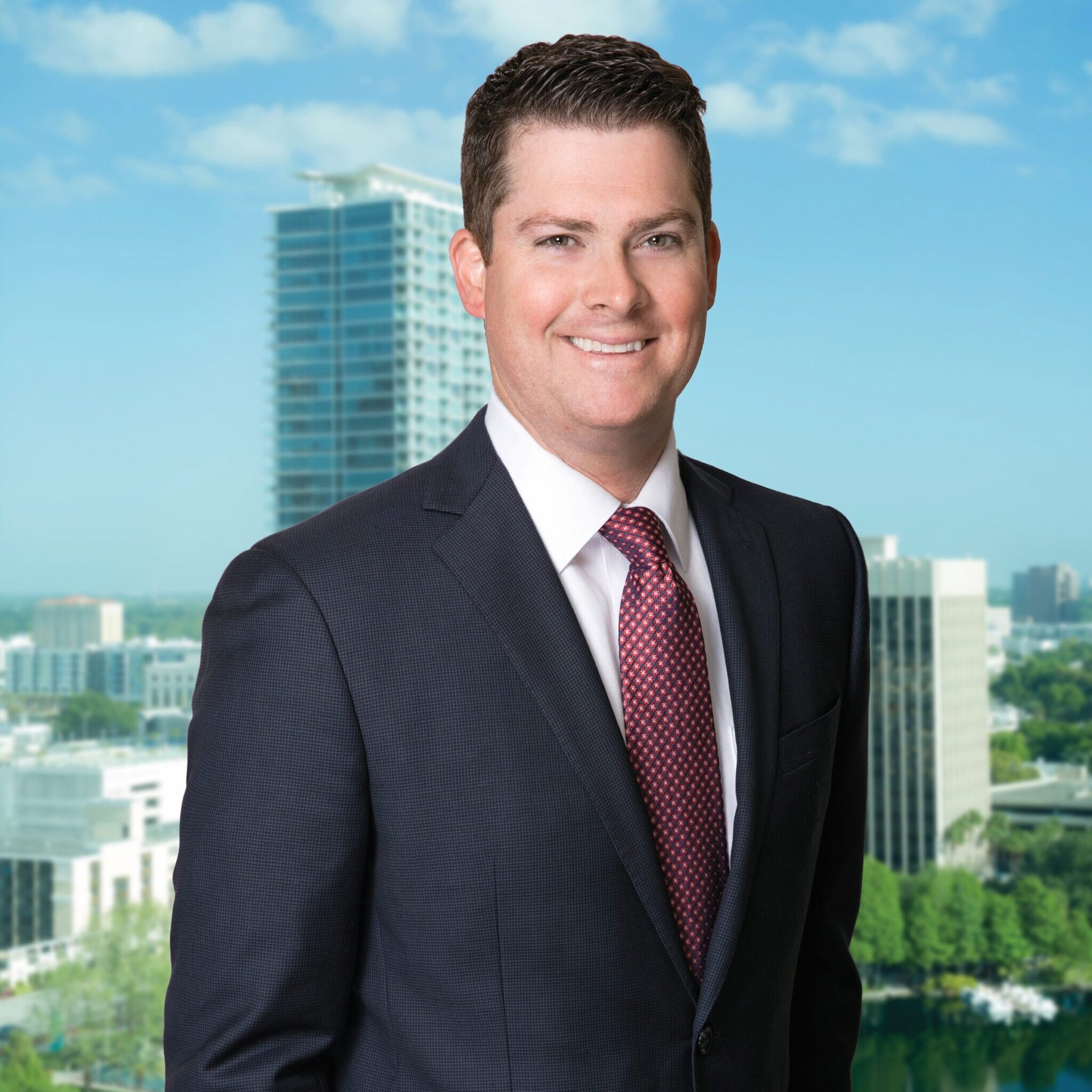 Business man smiling at camera in front of white background